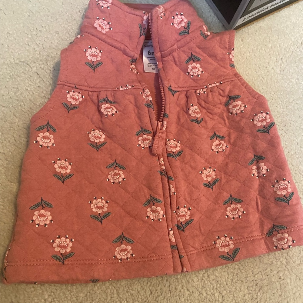 3 infant girl vests. 2 from carters size 6m and one from baby gap size 6-12m
